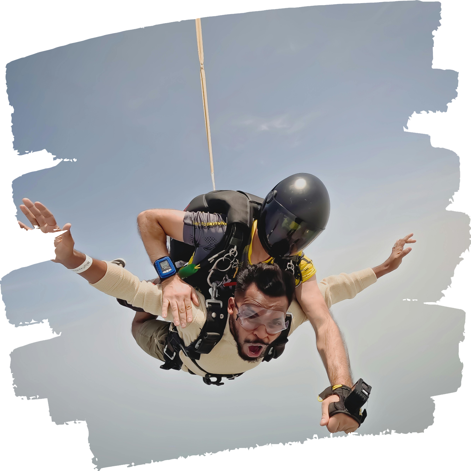 Saut tandem premium hélicoptère avec passager en chute libre filmé en face caméra